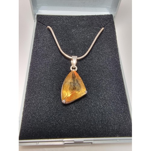 186 - A pretty 925 silver pendant inset with a large genuine citrine stone set on an 18