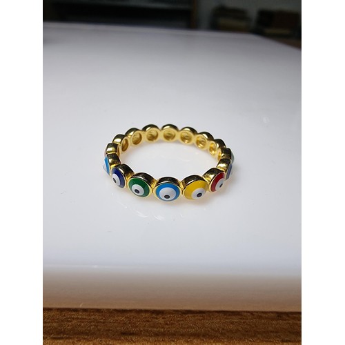 188 - A gold on 925 silver Bullseye ring with different coloured enamel eyes all the way around, in as new... 