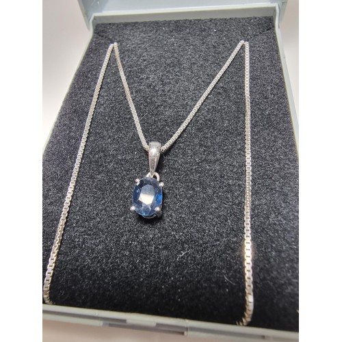 190 - A pretty 925 silver pendant inset with a genuine blue sapphire stone on an 18