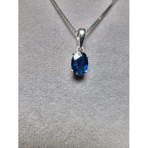 190 - A pretty 925 silver pendant inset with a genuine blue sapphire stone on an 18