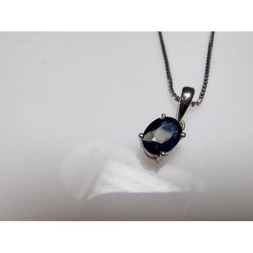 190 - A pretty 925 silver pendant inset with a genuine blue sapphire stone on an 18