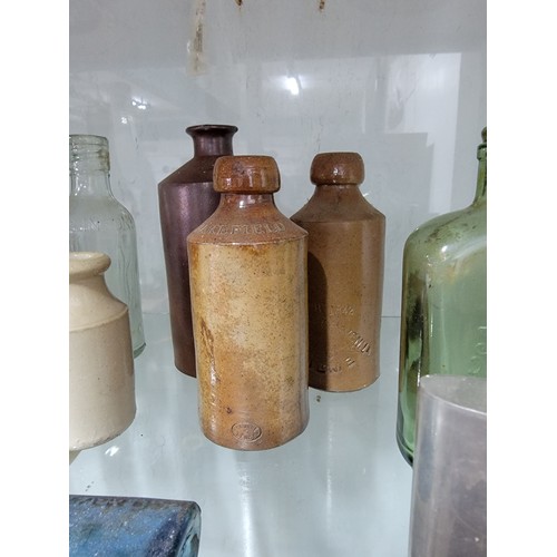 304 - Large quantity of glass and earthenware bottles inc local beer bottles, Al's Sauce, and a quantity o... 