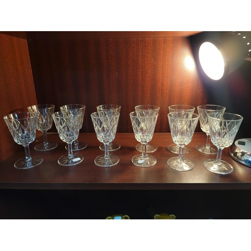 323 - Collection of 12 cut glass glasses in good order