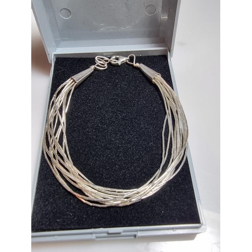 195 - A 925 silver multi strand bracelet in good clean condition, boxed. Length 7.5