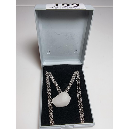 199 - A good quality 925 silver necklace to include a polished rough cut white chalcedony stone pendant on... 