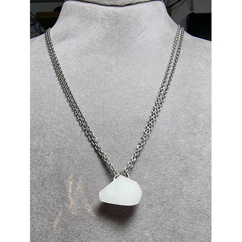 199 - A good quality 925 silver necklace to include a polished rough cut white chalcedony stone pendant on... 