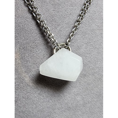 199 - A good quality 925 silver necklace to include a polished rough cut white chalcedony stone pendant on... 