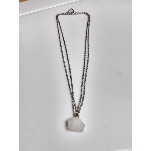 199 - A good quality 925 silver necklace to include a polished rough cut white chalcedony stone pendant on... 