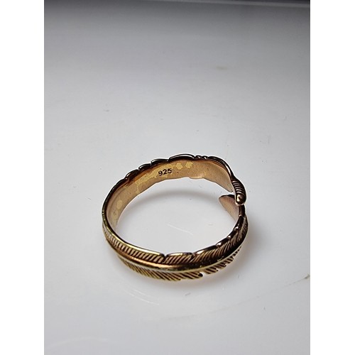 201 - A gold plated on 925 silver feather formed expandable ring. In good clean condition, boxed. Size M a... 