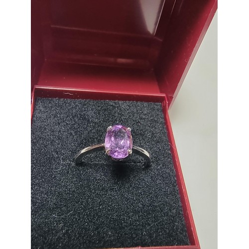 203 - A pretty 925 silver unused ring with a large amethyst stone inset in good clean unused condition, ma... 