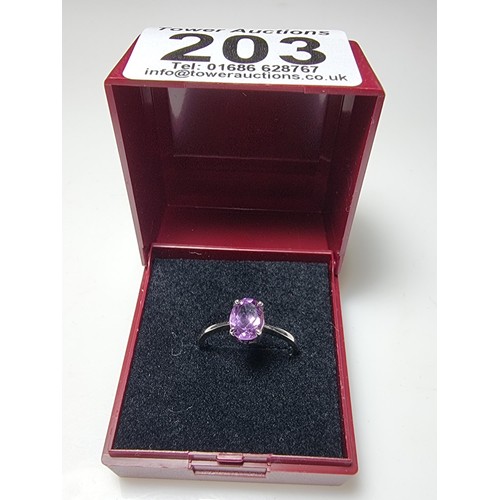 203 - A pretty 925 silver unused ring with a large amethyst stone inset in good clean unused condition, ma... 