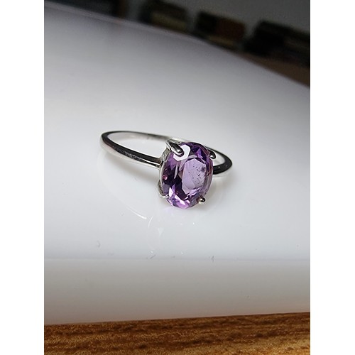 203 - A pretty 925 silver unused ring with a large amethyst stone inset in good clean unused condition, ma... 