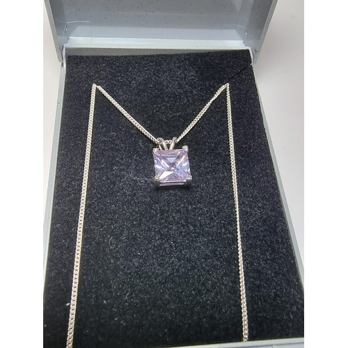 205 - A pretty 925 silver pendant with a faceted light purple coloured CZ crystal stone on an 18