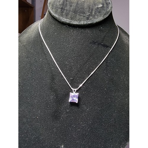 205 - A pretty 925 silver pendant with a faceted light purple coloured CZ crystal stone on an 18