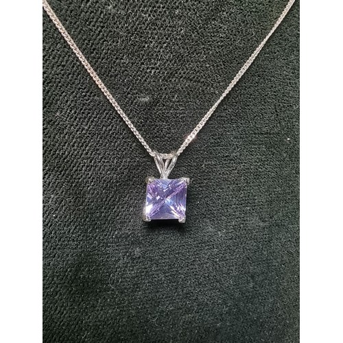 205 - A pretty 925 silver pendant with a faceted light purple coloured CZ crystal stone on an 18