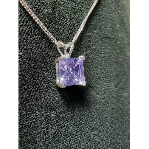 205 - A pretty 925 silver pendant with a faceted light purple coloured CZ crystal stone on an 18