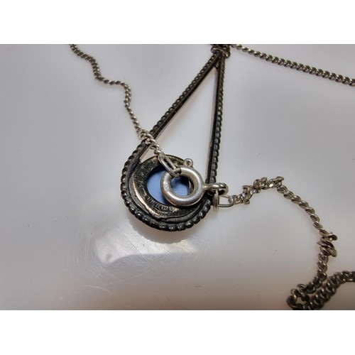 208 - A 925 hallmarked silver pendant with a blue bisque flower insert set on a good 18