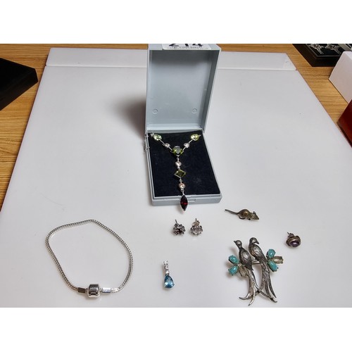 214 - A collection of various 925 silver jewellery to include an ornate long drop necklace inset with vari... 