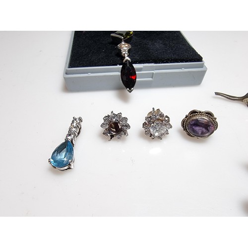 214 - A collection of various 925 silver jewellery to include an ornate long drop necklace inset with vari... 