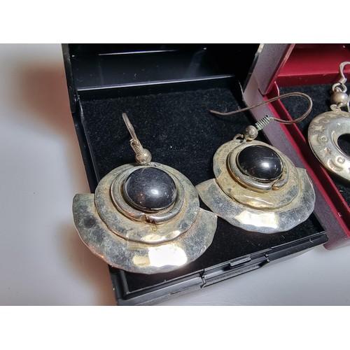 216 - 2 pairs of large 925 silver drop earrings both in good condition and boxed.