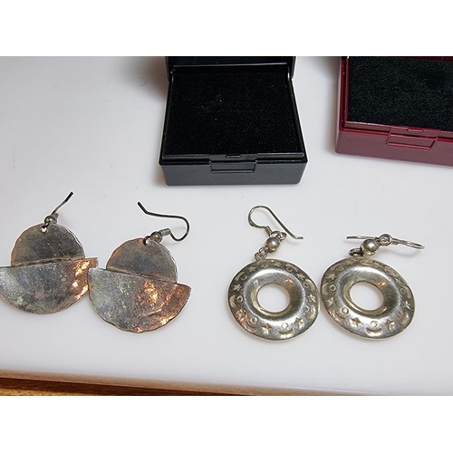 216 - 2 pairs of large 925 silver drop earrings both in good condition and boxed.