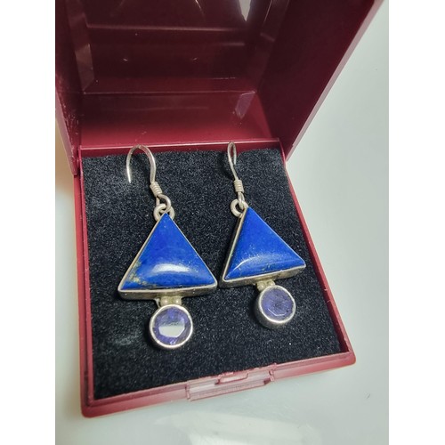 217 - A pair of ornate 925 silver drop earrings inset with triangular formed lapis lazuli stones and ameth... 