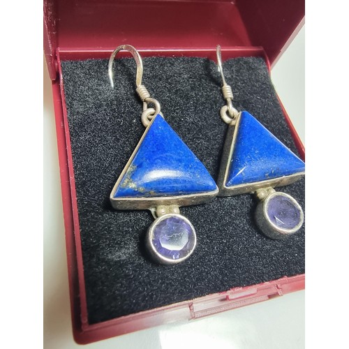 217 - A pair of ornate 925 silver drop earrings inset with triangular formed lapis lazuli stones and ameth... 