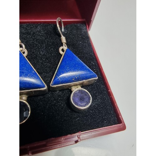 217 - A pair of ornate 925 silver drop earrings inset with triangular formed lapis lazuli stones and ameth... 