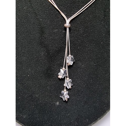 218 - A 925 silver double strand necklace with long crystal glass star drops on an 18