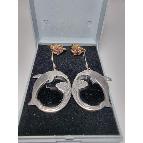 225 - A pair of large 925 silver dolphin drop earrings along with a pair of pretty 14k rolled gold screw b... 