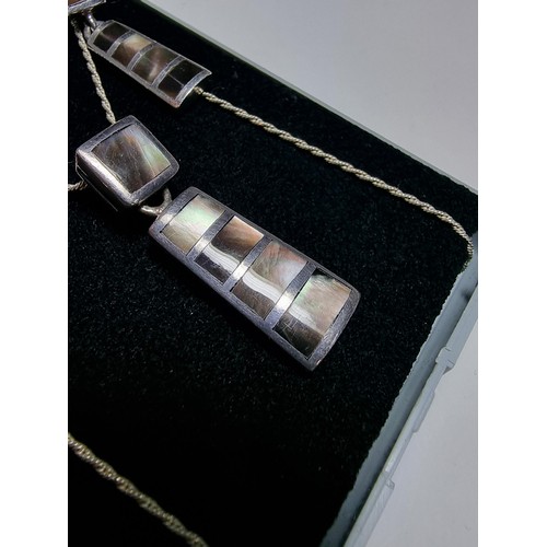 226 - A good quality 925 silver matching jewellery set to include a pendant inset with mother of pearl on ... 