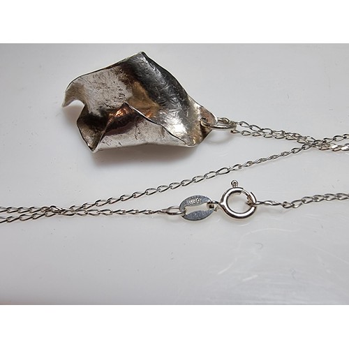 227 - A hand crafted 925 silver pendant set on a long 24