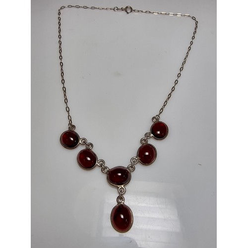 228 - A pretty 925 silver drop necklace inset with red garnet stones, in excellent clean condition, boxed ... 