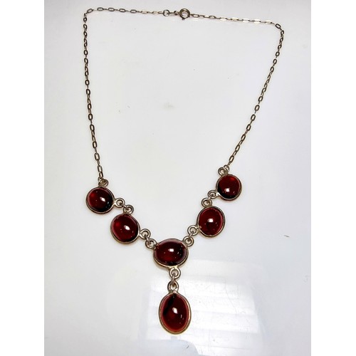 228 - A pretty 925 silver drop necklace inset with red garnet stones, in excellent clean condition, boxed ... 