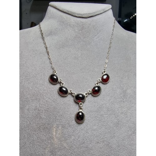 228 - A pretty 925 silver drop necklace inset with red garnet stones, in excellent clean condition, boxed ... 