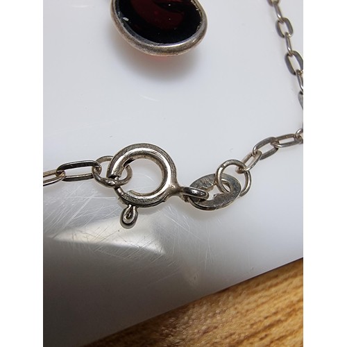 228 - A pretty 925 silver drop necklace inset with red garnet stones, in excellent clean condition, boxed ... 