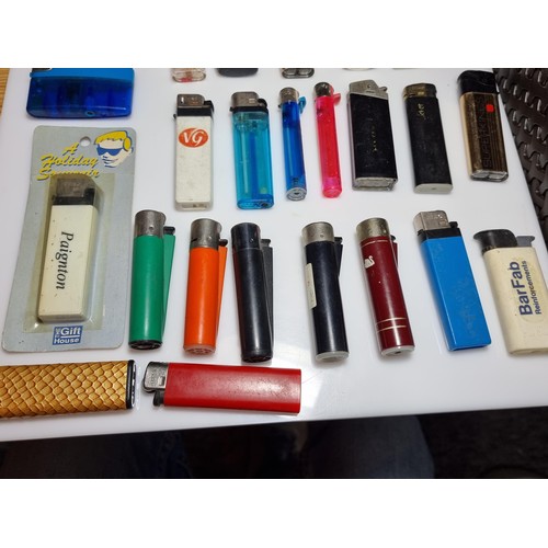 230 - A large collection of various vintage lighters including a good selection of clipper lighters, adver... 