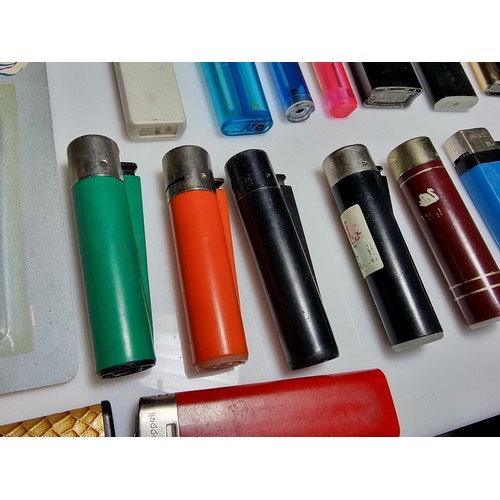 230 - A large collection of various vintage lighters including a good selection of clipper lighters, adver... 