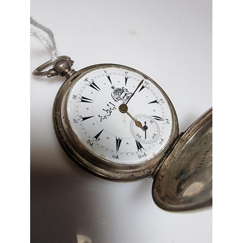 233 - A hallmarked silver foreign full hunter pocket watch featuring an enamel dial with an Arabic script ... 