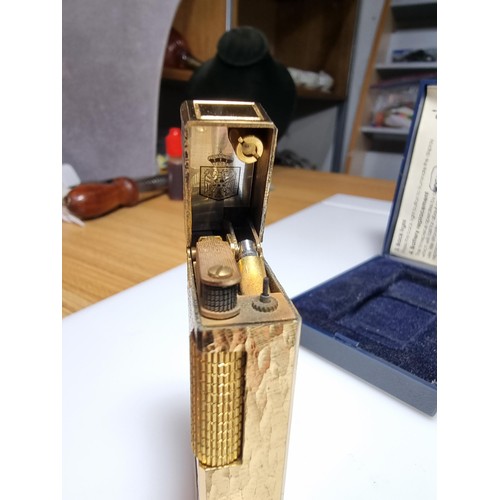 237 - A vintage cased Sunnex clock lighter along with a tie pin, the Sunnex lighter is in perfect working ... 