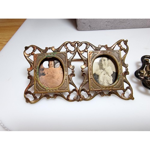 238 - A collection of vintage items to include an arts and crafts copper double photo frame and an arts an... 