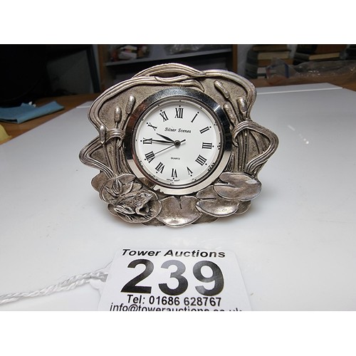 239 - A pretty silver plated art nouveau style desk clock by Silver Scenes featuring a frog and lily pad d... 