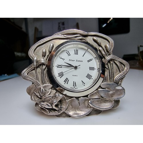 239 - A pretty silver plated art nouveau style desk clock by Silver Scenes featuring a frog and lily pad d... 