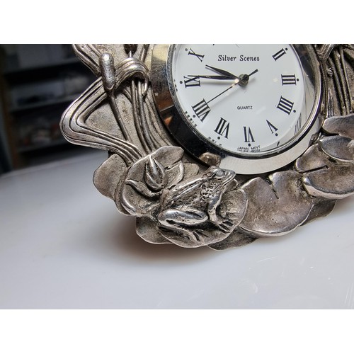 239 - A pretty silver plated art nouveau style desk clock by Silver Scenes featuring a frog and lily pad d... 