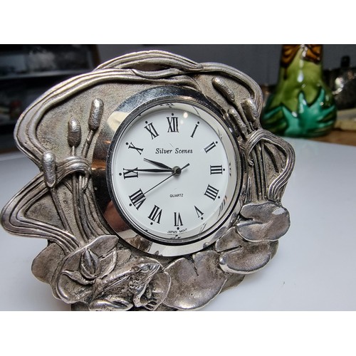 239 - A pretty silver plated art nouveau style desk clock by Silver Scenes featuring a frog and lily pad d... 