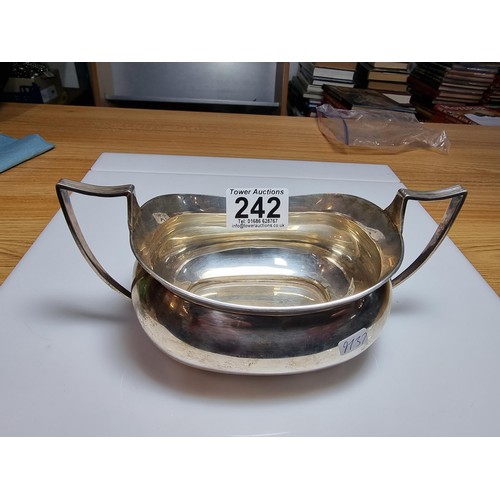 242 - A large hallmarked solid silver 2 handled bowl, hallmarked for Chester 1924 by the Barker brothers. ... 