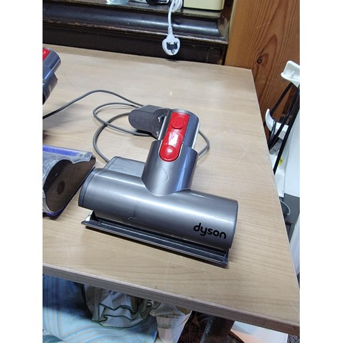 Dyson V7 vacuum cleaner with multiple attachments with brand new