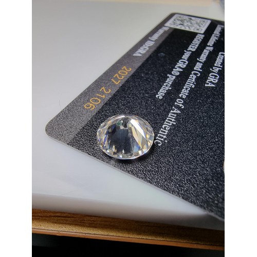 250 - A 5ct moissanite diamond with a diameter of 11mm with full report, the moissanite has a colour grade... 