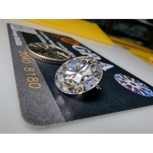 252 - A 6ct moissanite diamond with a diameter of 12mm with full report, the moissanite has a colour grade... 