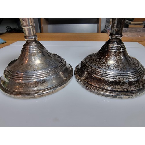 244 - A pair of hallmarked solid silver candlesticks with weighted bases, hallmarked for Birmingham 1960 b... 